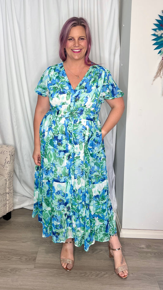 Vina Midi Dress: 
The Vina Dress features a soft floral print in watercolour blue and gold thread, with flutter sleeves and a shirred waist band creating a stunning silhouette
Featur - Ciao Bella Dresses - Boho Australia