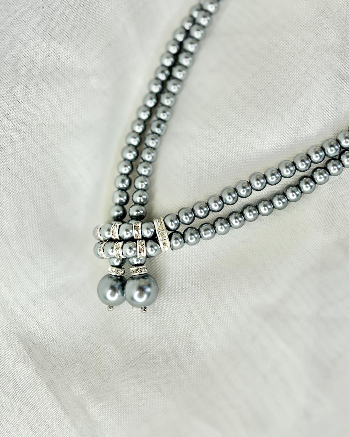 Gatsby Necklace - Pearl Strand | Glam Accessories | Our beaded necklaces are the perfect addition to your next Gatsby inspired event. These gorgeous designs can also be incorporated into modern outfit
This stunning de