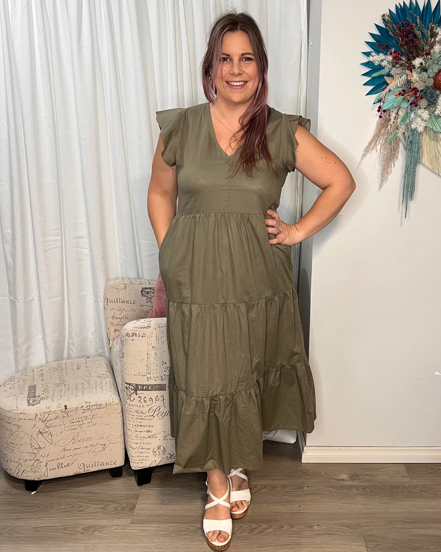 Kelsea Tiered Dress | Sass Clothing |
Step out in style with the Kelsea Tiered Midi Dress - the perfect blend of comfort and sophistication. This dress features flutter sleeves, a tiered skirt, and a fl