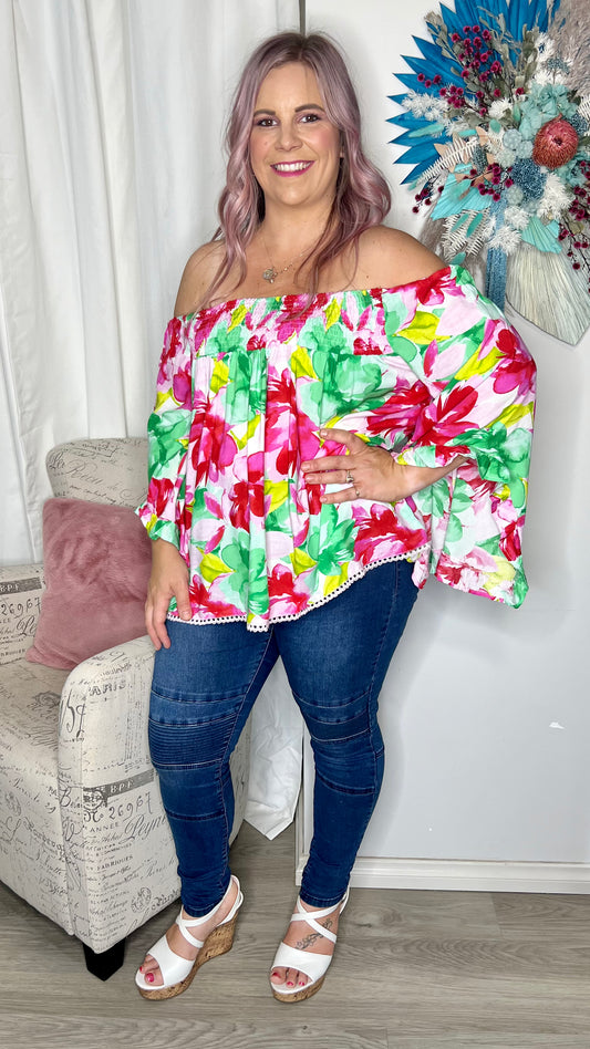 Reese Top - Multi Floral: Holiday vibes time a hundred! The Reese Top brings comfort and effortless vibes together in a beautiful flash of colour

Floaty bell sleeves
Shirred band at top can  - Ciao Bella Dresses - Label of Love