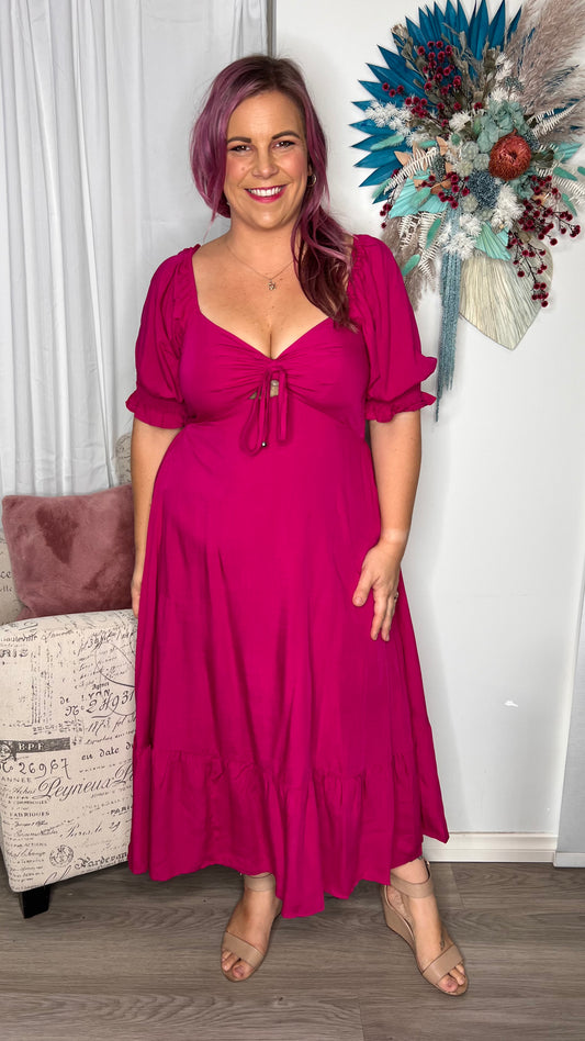 Raya Midi Dress: 
The Raya Dress is a stunning shape that is perfect for your next event. It was so many super cute details such as a cut out gathered bust, puff sleeves with shirred - Ciao Bella Dresses - Mylk the Label