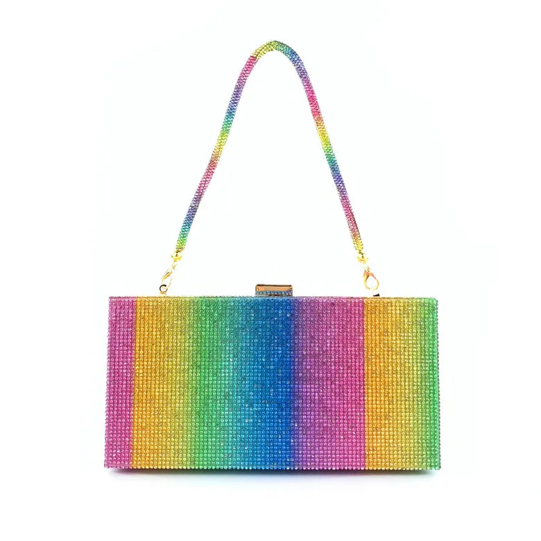 Alina Evening Bag | Ciao Bella Dresses | The Alina Evening Bag has all the colour and sparkle one could dream of. This bag will bring any outfit to life
Features:
Top clasp
Gorgeous block rainbow pattern
T