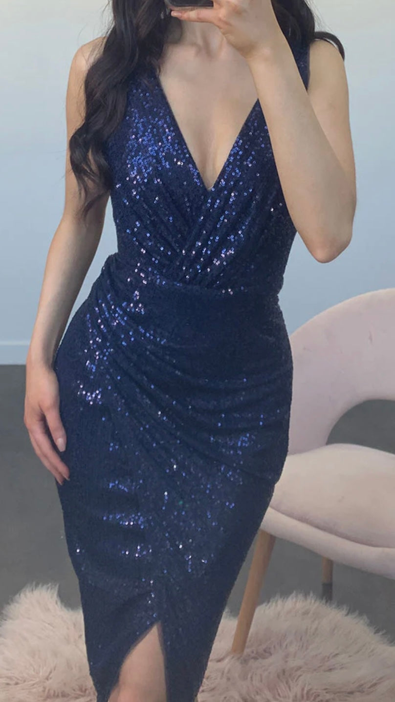 Be the life of the party in our Kim v-wrap sequin midi! Get in a bit of glam with these glitzy sequins paired with a stunning wrap skirt. It's the perfect dress for - Kim Sequin Dress - Navy - Lumier by Bariano