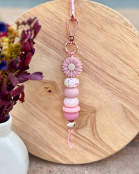 Oto & Iti Keyring | Oto & Iti | Add some personality to your keys or bag with a handmade keyring by Oto &amp; Iti
Features: 

Lobster claw
Silicone beads
Varied designs

Hardware: Varied - gold loo