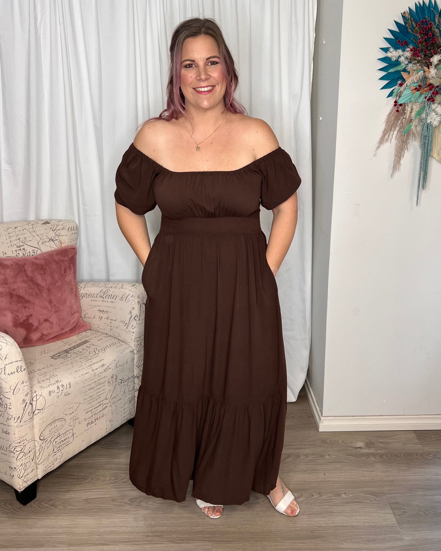 Yasmin Midi Dress - Brown | Sass Clothing | Introducing the Yasmin Frill Hem Midi Dress! With its flirty frill hem and elasticated square neckline, it exudes confidence and grace. The back shirred panel ensure