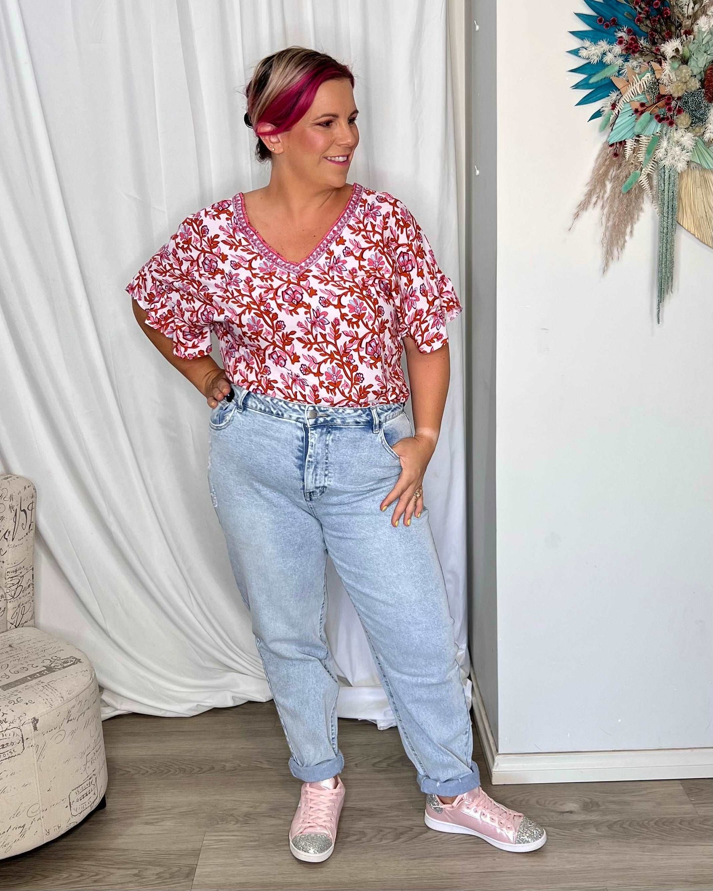 **NEW** Ashley V-Neck Top: Elevate your casual chic with the Ashley V-Neck Top! Designed for a relaxed fit, this top features a flattering V neckline and playful fluted short sleeves for a tou - Ciao Bella Dresses - Sass Clothing