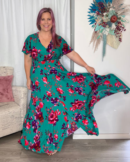 Liliana Maxi Dress: The Liliana Dress features a rich green background with a gorgeous deep red rose patten in one of our most popular shapes. This stunning dress features a thick shirr - Ciao Bella Dresses 