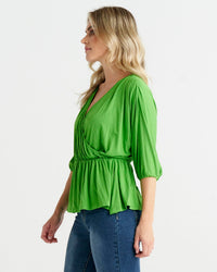 Bayeaux Wrap Top - Green | Betty Basics | The Bayeaux Top combines a classic shape with a comfortable fit, making this the go to when pairing with your fave bottoms
Features:

Faux wrap (breastfeeding friend