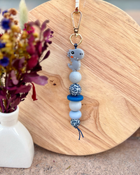 Oto & Iti Keyring | Oto & Iti | Add some personality to your keys or bag with a handmade keyring by Oto &amp; Iti
Features: 

Lobster claw
Silicone beads
Varied designs

Hardware: Varied - gold loo