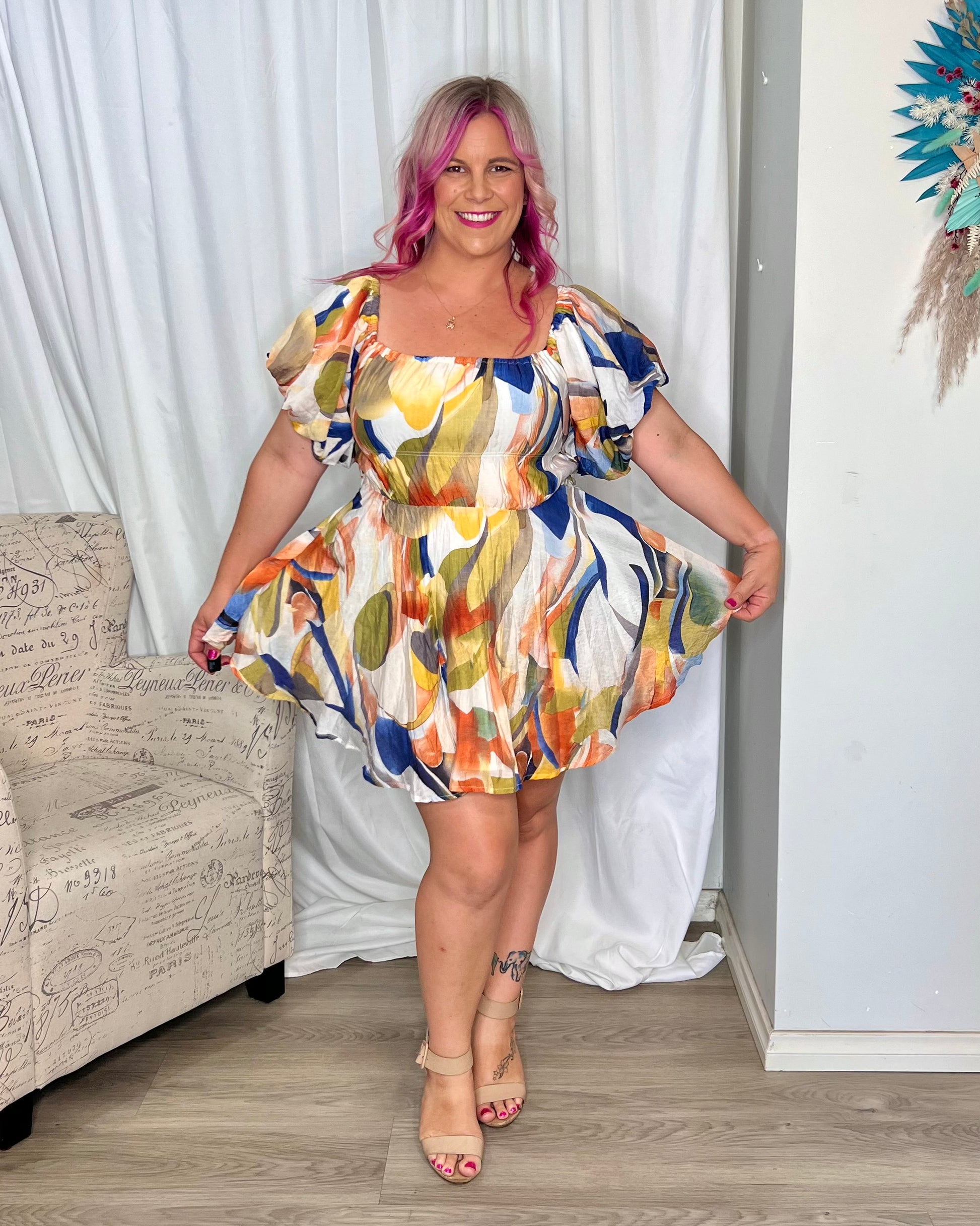 *NEW* Nara Mini Dress | Mica by Amica | The Nara Dress comes in a fantastic white multi abstract print, this cute mini style has an off shoulder neckline that can also be worn on the shoulders. It features