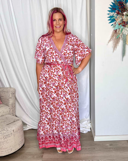 *NEW* Ashley Wrap Dress | Sass Clothing | Dress to impress with the Ashley Midi Wrap Dress! This chic wardrobe staple combines timeless elegance with a modern twist. With a flattering wrap design, Ashley ens