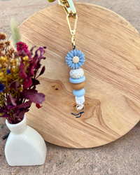 Oto & Iti Keyring | Oto & Iti | Add some personality to your keys or bag with a handmade keyring by Oto &amp; Iti
Features: 

Lobster claw
Silicone beads
Varied designs

Hardware: Varied - gold loo