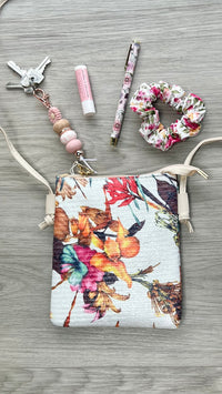 Crossbody Pouch Bag | IVYS | The perfect style upgrade can be found with the Crosshatch Tassel Crossbody Bag. Choose your ideal shade from our range and don't be afraid to flaunt it. This purse 