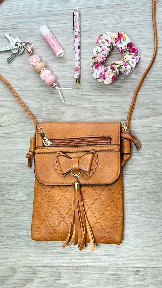 *NEW* Crossbody Bag - Butterfly Tassel: The perfect match to any outfit, our Butterfly Tassel Crossbody Bag is the must have accessory. Coming in a range of colours, you'll find one to match the mood
This  - Ciao Bella Dresses