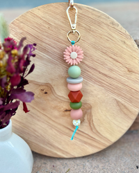 Oto & Iti Keyring | Oto & Iti | Add some personality to your keys or bag with a handmade keyring by Oto &amp; Iti
Features: 

Lobster claw
Silicone beads
Varied designs

Hardware: Varied - gold loo