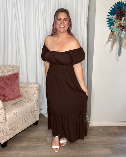 Yasmin Midi Dress - Brown | Sass Clothing | Introducing the Yasmin Frill Hem Midi Dress! With its flirty frill hem and elasticated square neckline, it exudes confidence and grace. The back shirred panel ensure