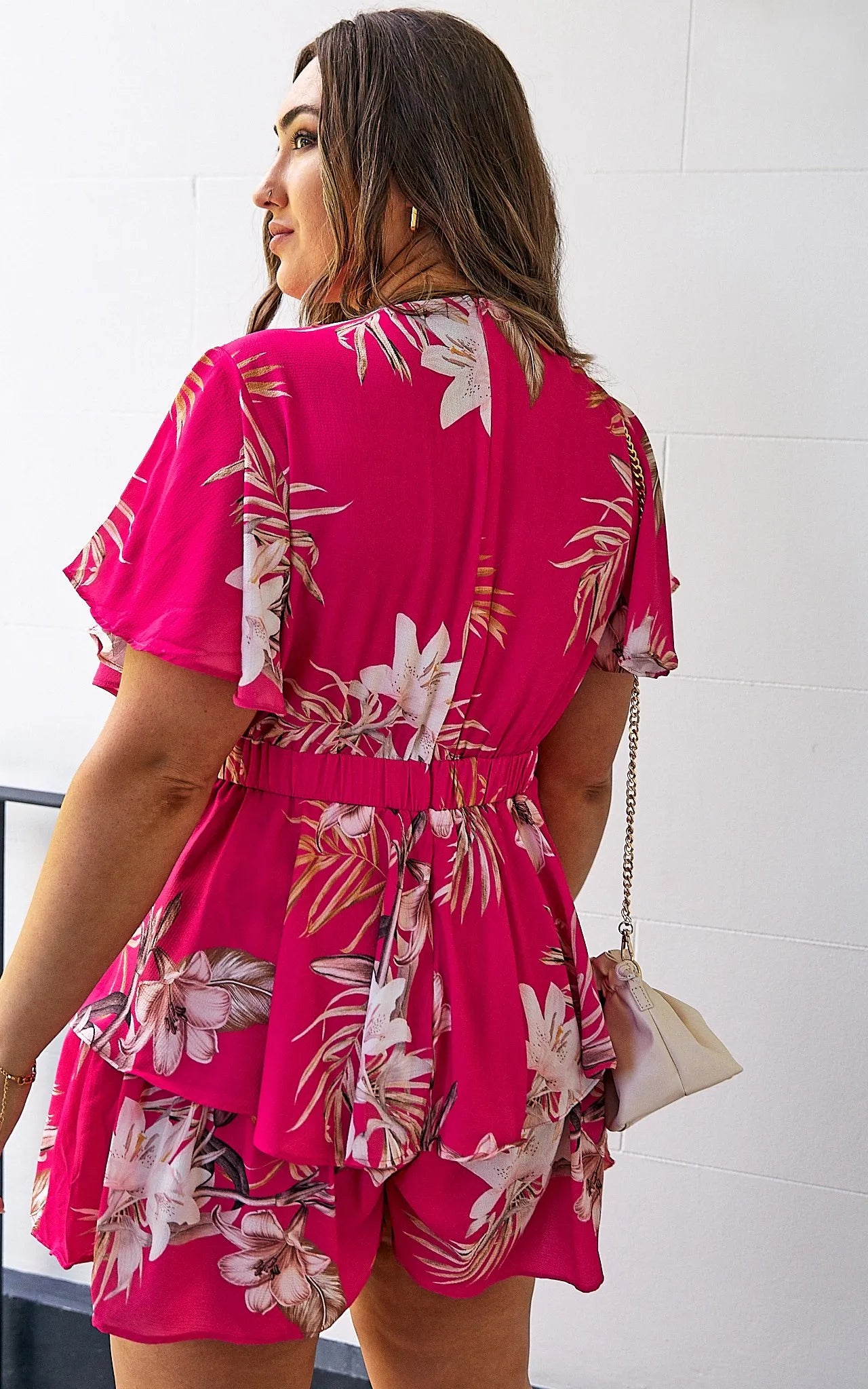 *NEW* Lynette Playsuit - Hot Pink Floral | Sao by Dee | The Lynette Playsuit features a gorgeous V neckline, attached waist tie to tie to the front and a tiered ruffle overlay on the bottom half. A reason to love a playsu