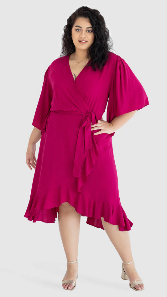 Gabrielle Wrap Dress:  The Gabrielle dress is a truly stunning offering. It features beautiful ruffles to the front and graceful, full-length sleeves, for a delicate, and timeless silhoue - Ciao Bella Dresses 