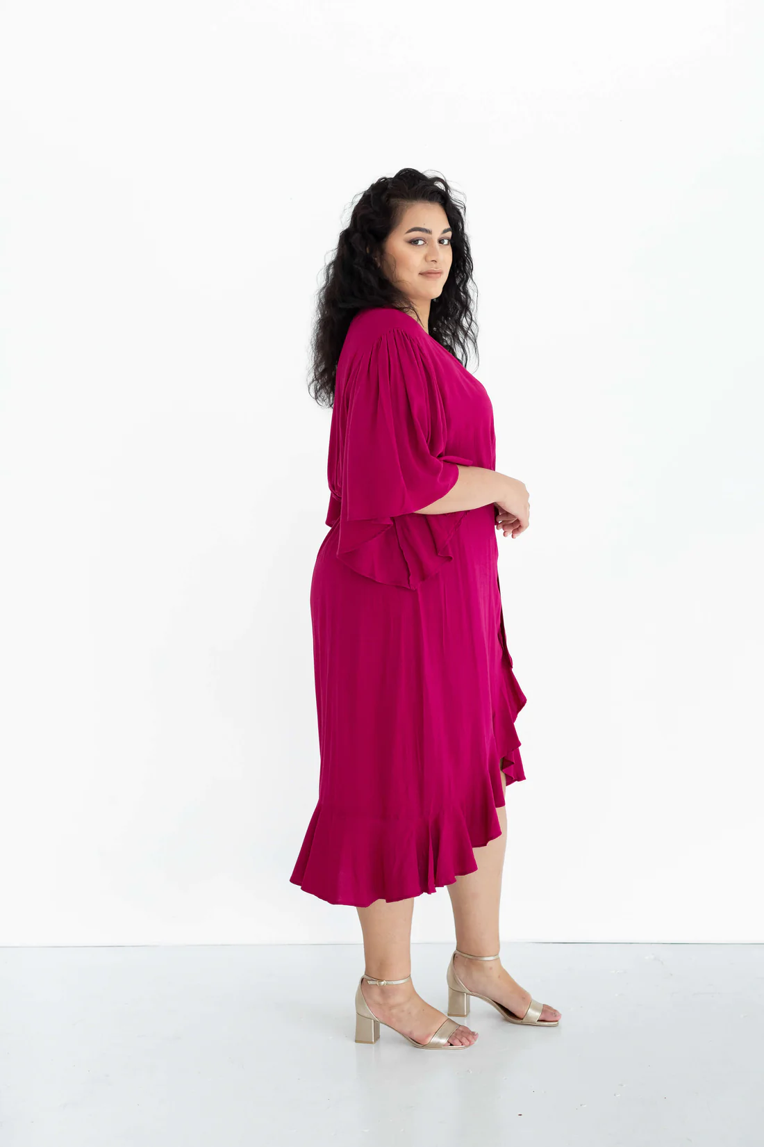 Gabrielle Wrap Dress:  The Gabrielle dress is a truly stunning offering. It features beautiful ruffles to the front and graceful, full-length sleeves, for a delicate, and timeless silhoue - Ciao Bella Dresses 