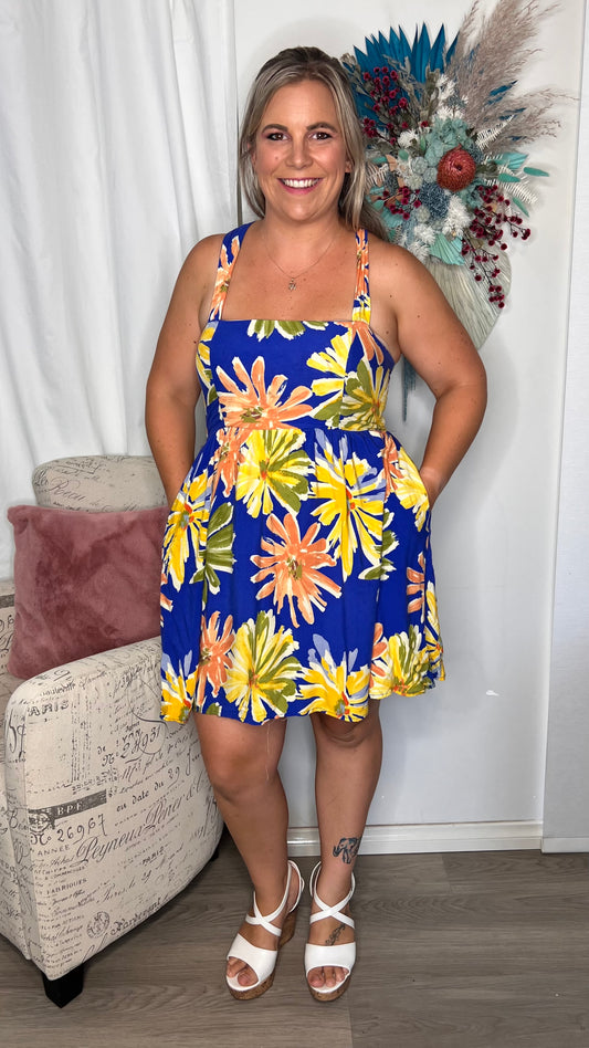 Mae Dress: This sweet little summer dress will brighten the day of everyone around you
Features:

Shirred panels at side for adjustable bust
Convertible back - wear it in a mul - Ciao Bella Dresses 