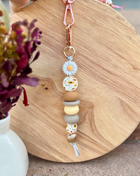 Oto & Iti Keyring | Oto & Iti | Add some personality to your keys or bag with a handmade keyring by Oto &amp; Iti
Features: 

Lobster claw
Silicone beads
Varied designs

Hardware: Varied - gold loo