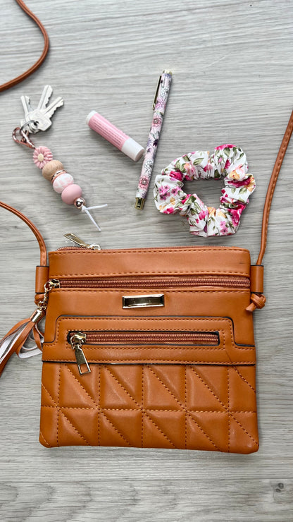 *NEW* Crossbody Bag - Quilted Square:  
Elevate your daily style with our Quilted Square Crossbody Bag – a combination of practicality, fashion, and sophistication. Whether you're headed to the office, a - Ciao Bella Dresses