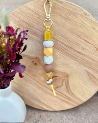 Oto & Iti Keyring | Oto & Iti | Add some personality to your keys or bag with a handmade keyring by Oto &amp; Iti
Features: 

Lobster claw
Silicone beads
Varied designs

Hardware: Varied - gold loo