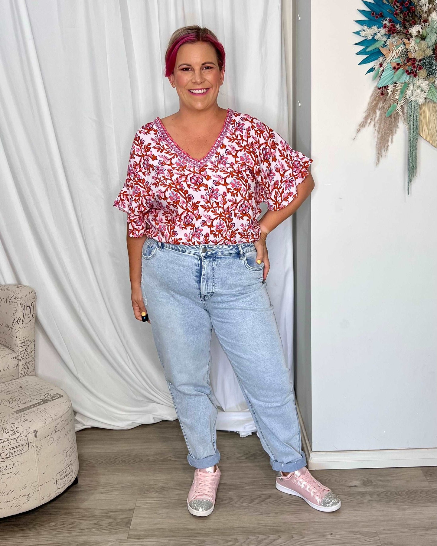 **NEW** Ashley V-Neck Top: Elevate your casual chic with the Ashley V-Neck Top! Designed for a relaxed fit, this top features a flattering V neckline and playful fluted short sleeves for a tou - Ciao Bella Dresses - Sass Clothing