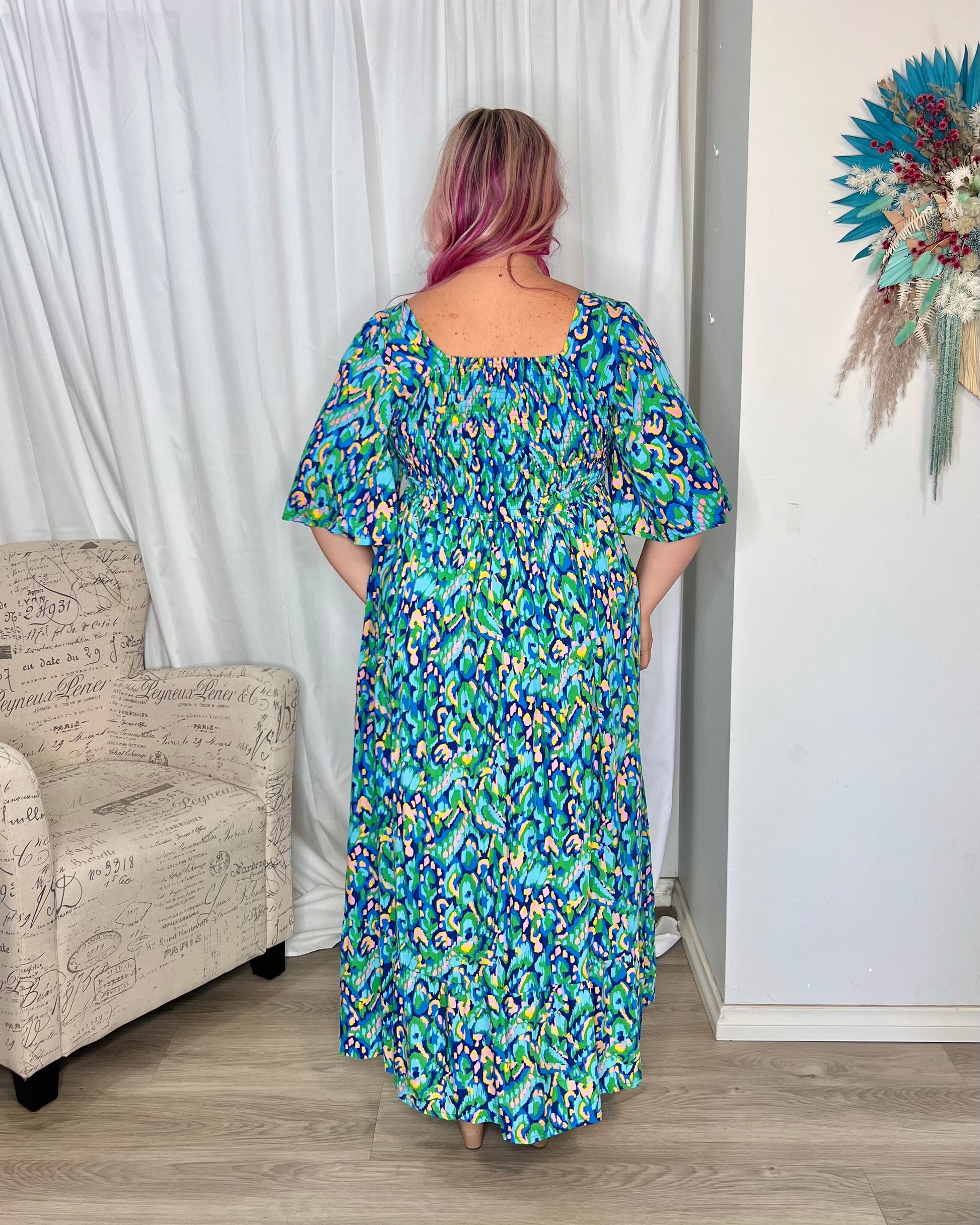 *NEW* Kalani Maxi Dress: 
Our Kalani Dress is a summer show stopper! That print, the cut, the maxi length ... it is stunning. A flattering square cut neckline is complimented by a flowing sl - Ciao Bella Dresses - Bee Maddison