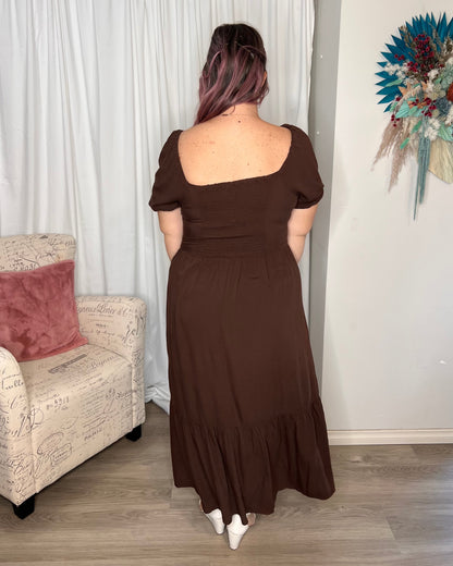 Yasmin Midi Dress - Brown | Sass Clothing | Introducing the Yasmin Frill Hem Midi Dress! With its flirty frill hem and elasticated square neckline, it exudes confidence and grace. The back shirred panel ensure