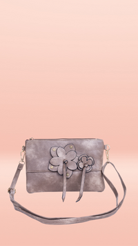 *NEW* Crossbody Bag - Flower Zip: Enjoy effortless style with the Flower Zip Crossbody Bag! Whether you prefer a dark hue or something more subtle, we have the perfect shade for you. This purse is su - Ciao Bella Dresses