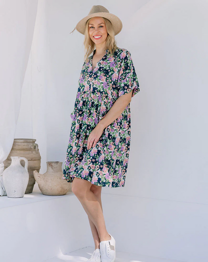 Ella Babydoll Mini Dress: Meet Ella, your new fave chuck on and go style! A babydoll design dress in a beautiful new floral print. Comfortable and flowing the dress features a V neckline, sho - Ciao Bella Dresses 