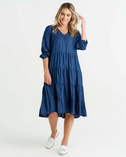 Janie Dress - Navy | Sass Clothing | Greet easy style with The Janie Dress! This comfy-chic frock features a fab relaxed tiered panel fit, an elegant V-neckline, and 3/4 elastic-cuffed sleeves - all to 