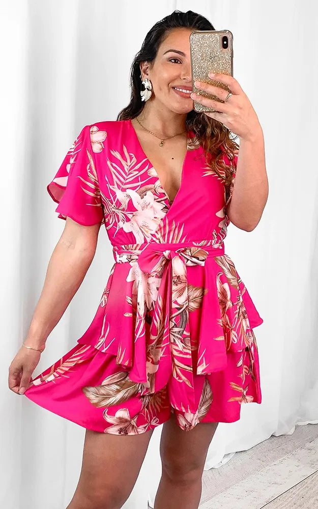 *NEW* Lynette Playsuit - Hot Pink Floral | Sao by Dee | The Lynette Playsuit features a gorgeous V neckline, attached waist tie to tie to the front and a tiered ruffle overlay on the bottom half. A reason to love a playsu