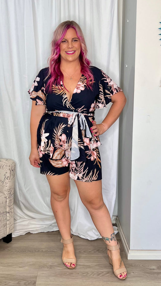 *NEW* Lynette Playsuit - Black Floral | Sao by Dee | The Lynette Playsuit features a gorgeous V neckline, attached waist tie to tie to the front and a tiered ruffle overlay on the bottom half. A reason to love a playsu