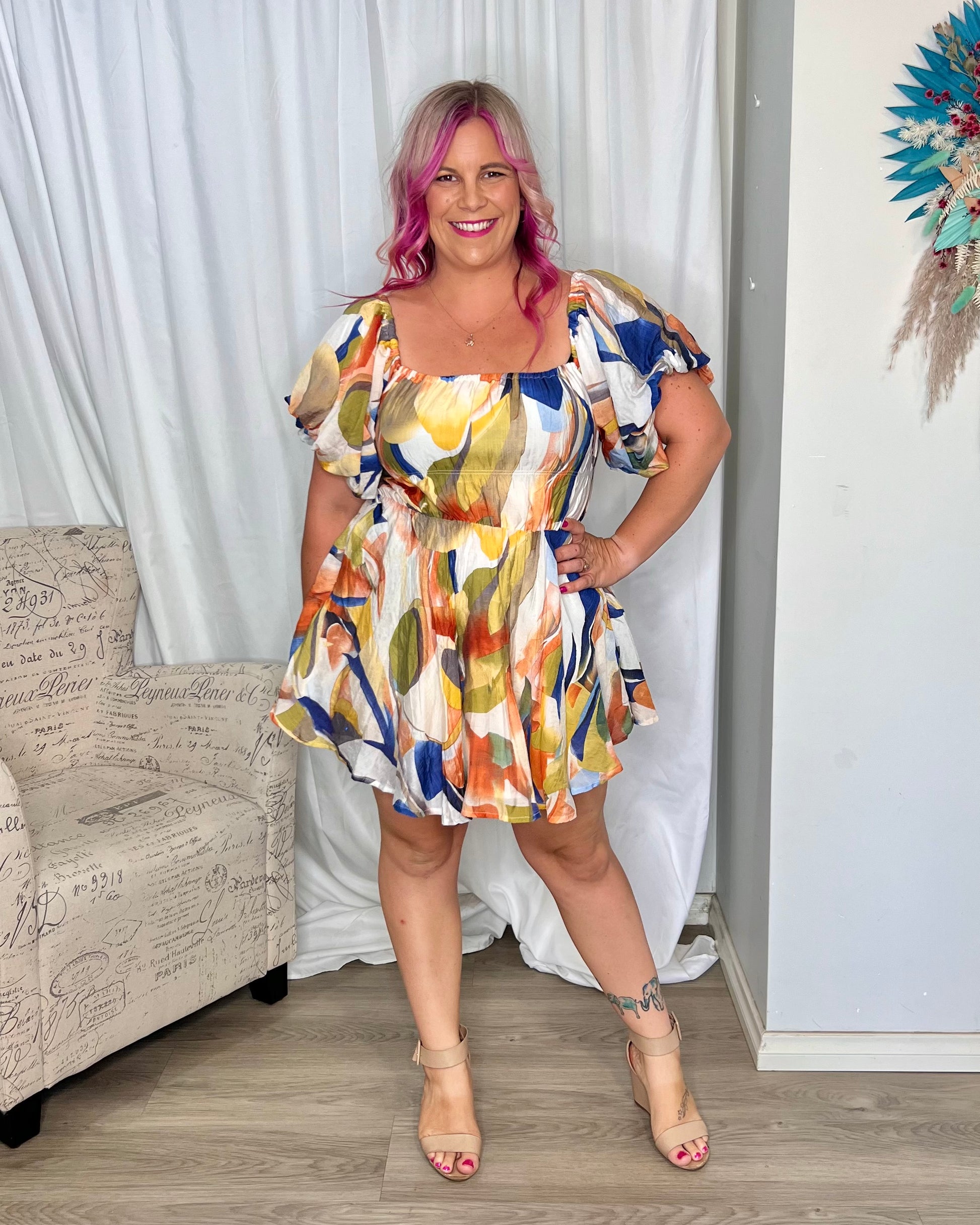 **NEW** Nara Mini Dress: The Nara Dress comes in a fantastic white multi abstract print, this cute mini style has an off shoulder neckline that can also be worn on the shoulders. It features - Ciao Bella Dresses - Mica by Amica