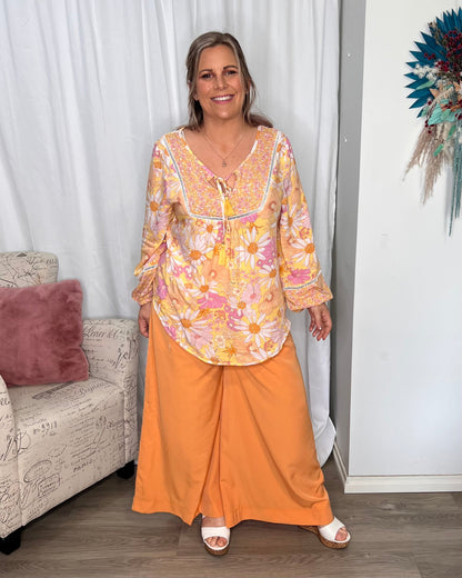 Lillian Palazzo Pants - Melon | Sass Clothing | The Lillian Palazzo Pants are a stunning shape to take you from office to after hours, year round. The pleats at the top streamline into a wide leg for the utmost in