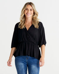 Bayeaux Wrap Top - Black | Betty Basics | The Bayeaux Top combines a classic shape with a comfortable fit, making this the go to when pairing with your fave bottoms
Features:

Faux wrap (breastfeeding friend