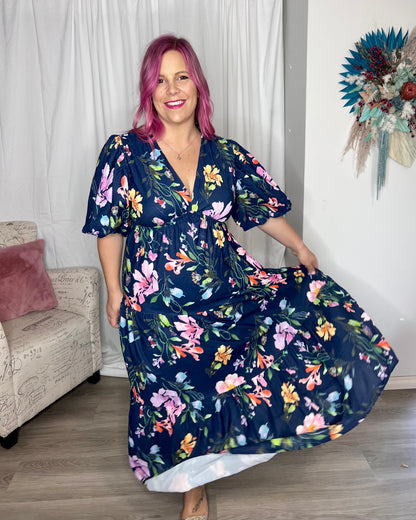 Picture Perfect Floral Midi Dress | Ebby and I | Picture Perfect by name, Picture Perfect by nature. The stunning watercolour floral print against a navy background make this dress the picture perfect option to you