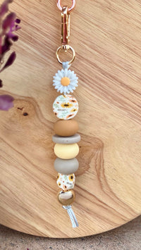 Oto & Iti Keyring | Oto & Iti | Add some personality to your keys or bag with a handmade keyring by Oto &amp; Iti
Features: 

Lobster claw
Silicone beads
Varied designs

Hardware: Varied - gold loo