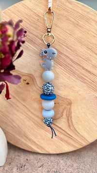 Oto & Iti Keyring | Oto & Iti | Add some personality to your keys or bag with a handmade keyring by Oto &amp; Iti
Features: 

Lobster claw
Silicone beads
Varied designs

Hardware: Varied - gold loo