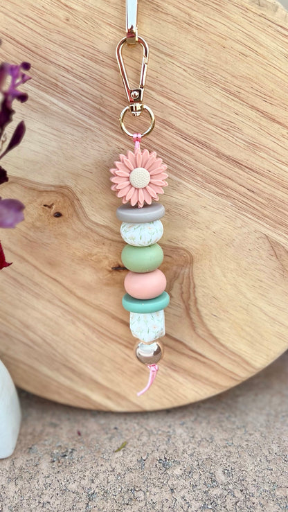 **NEW** Oto & Iti Keyring: Add some personality to your keys or bag with a handmade keyring by Oto &amp; Iti
Features: 

Lobster claw
Silicone beads
Varied designs

Hardware: Varied - gold loo - Ciao Bella Dresses 