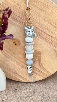 Oto & Iti Keyring | Oto & Iti | Add some personality to your keys or bag with a handmade keyring by Oto &amp; Iti
Features: 

Lobster claw
Silicone beads
Varied designs

Hardware: Varied - gold loo