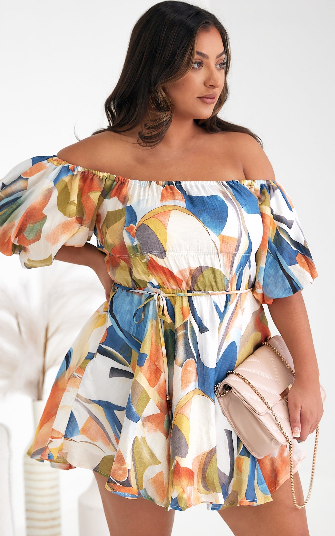 *NEW* Nara Mini Dress | Mica by Amica | The Nara Dress comes in a fantastic white multi abstract print, this cute mini style has an off shoulder neckline that can also be worn on the shoulders. It features