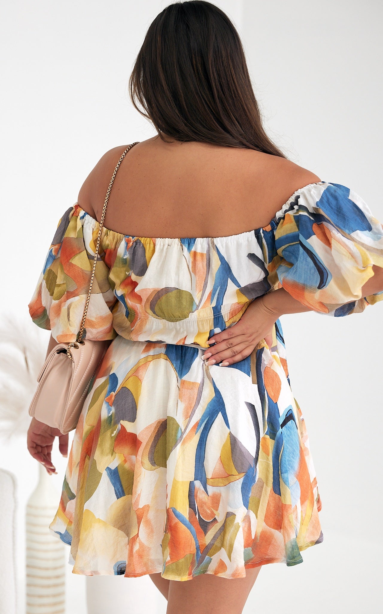 *NEW* Nara Mini Dress | Mica by Amica | The Nara Dress comes in a fantastic white multi abstract print, this cute mini style has an off shoulder neckline that can also be worn on the shoulders. It features