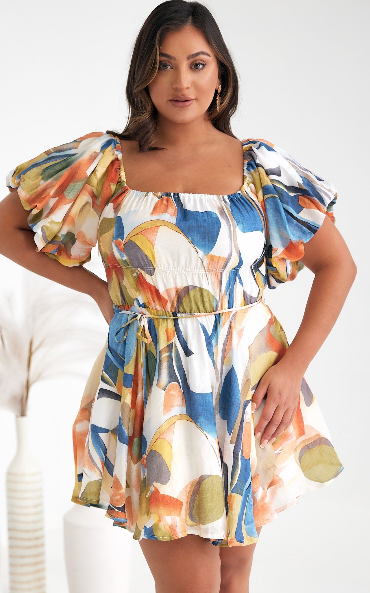 **NEW** Nara Mini Dress: The Nara Dress comes in a fantastic white multi abstract print, this cute mini style has an off shoulder neckline that can also be worn on the shoulders. It features - Ciao Bella Dresses - Mica by Amica