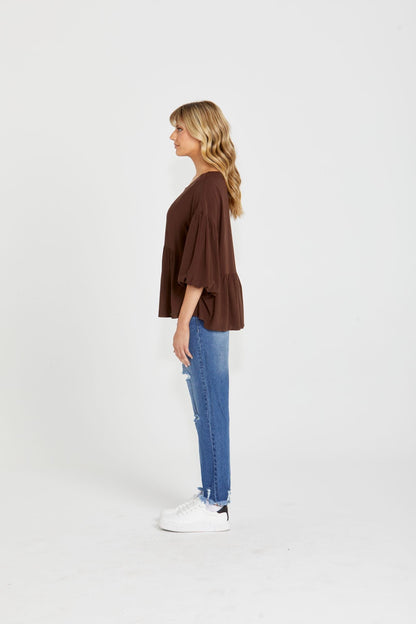 Yasmin Bubble Sleeve Top - Brown | Sass Clothing |  
With its trendy V-neckline and dropped shoulder into bubble sleeves, this top exudes effortless style. The relaxed fit offers ultimate comfort, while the back keyh