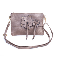 *NEW* Crossbody Bag - Flower Zip: Enjoy effortless style with the Flower Zip Crossbody Bag! Whether you prefer a dark hue or something more subtle, we have the perfect shade for you. This purse is su - Ciao Bella Dresses