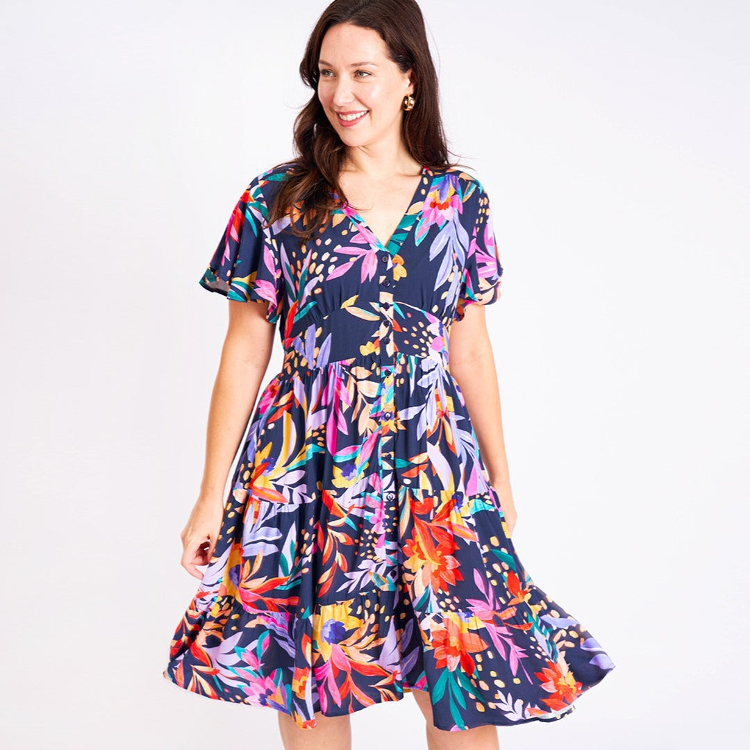 Elsa Mini Dress: Flutter sleeves and a structured button bust, the Elsa Dress features a beautiful new print on one of our most popular styles
Features:

Button up bust
Pockets
Shirr - Ciao Bella Dresses 