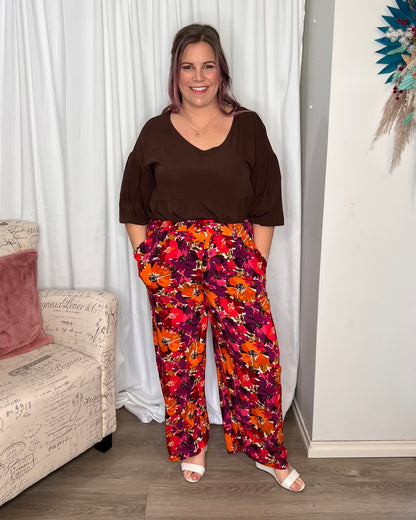 Yasmin Floral Wide Leg Pant:  
Introducing the Yasmin Wide Leg Pant - where comfort meets style in perfect harmony! With its flat front and elasticated back waist, these pants offer a flattering - Ciao Bella Dresses - Sass Clothing